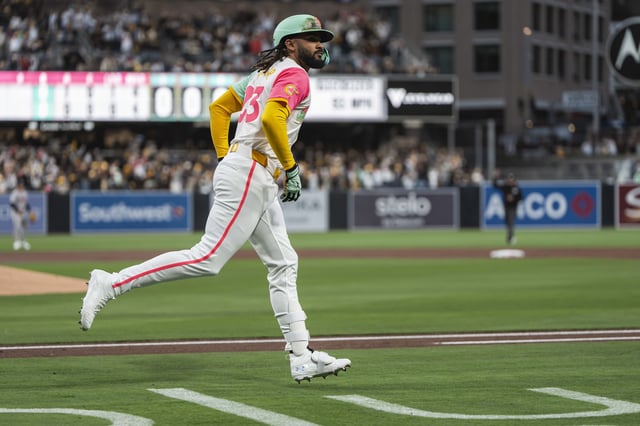 Fernando Tatis Jr. #23 of the San Diego Padres jogs around the bases after hitting a home run during the first inning of the game against the Atlanta Braves at Petco Park on March 28, 2025 in San Diego, California.