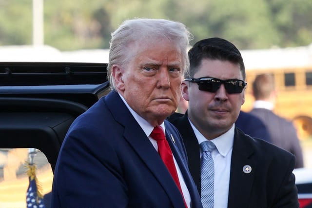 U.S. President Donald Trump looks on before he departs for Washington, from West Palm Beach, Florida, U.S., March 30, 2025. REUTERS/Kevin Lamarque