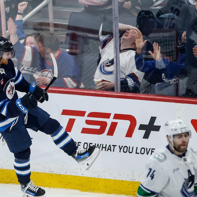Winnipeg Jets' Kyle Connor (81) celebrates his goal against the Vancouver Canucks during second period NHL action in Winnipeg on Sunday, March 30, 2025. THE CANADIAN PRESS/John Woods