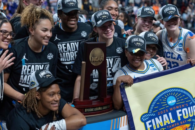 UCLA players pose for photos after a game against LSU in the Elite Eight of the NCAA college basketball tournament, Sunday, March 30, 2025, in Spokane, Wash. (AP Photo/Jenny Kane)
