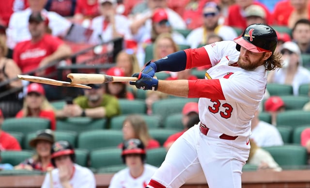 Mar 30, 2025; St. Louis, Missouri, USA; St. Louis Cardinals infielder Brendan Donovan (33) breaks his bat as he singled to centerfield in the third inning against the Minnesota Twins at Busch Stadium. Mandatory Credit: Tim Vizer-Imagn Images