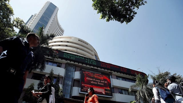 Stock market holiday for Eid-ul-Fitr: People walk past the Bombay Stock Exchange (BSE) building in Mumbai (Francis Mascarenhas/Reuters)