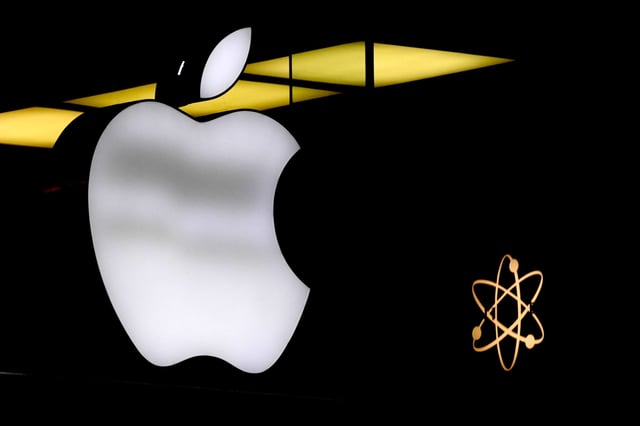 FILE - The Apple logo is illuminated at a store in Munich, Germany, Monday, Nov. 13, 2023. AP Photo/Matthias Schrader, File)(