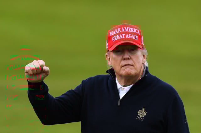 President Donald Trump reacts as he plays golf at the Trump Turnberry Golf Courses, in Turnberry on the west coast of Scotland on May 2, 2023
