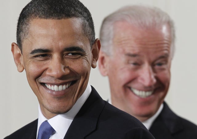 President Barack Obama and Vice President Joe Biden smile in the East Room of the White House in Washington, Tuesday, March 23, 2010, before the president signed the health care bill. (AP Photo/Charles Dharapak)