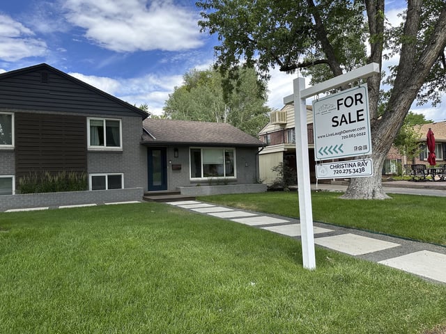FILE - A for sale sign stands outside a single-family home Thursday, June 27, 2024, in Englewood, Colo. (AP Photo/David Zalubowski, File)