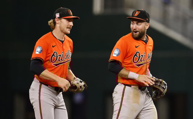 Gunnar Henderson #2 of the Baltimore Orioles and teammate Colton Cowser #17 celebrate the team&#39;s win over the Texas Rangers at Globe Life Field on July 20, 2024 in Arlington, Texas.