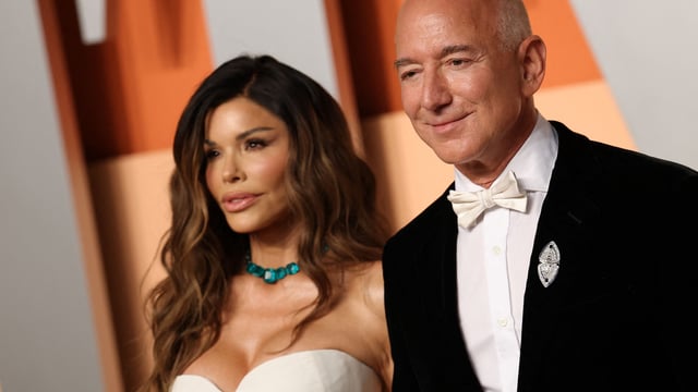 CEO of Amazon Jeff Bezos and partner Lauren Sanchez attend the Vanity Fair Oscar Party at the Wallis Annenberg Center for the Performing Arts in Beverly Hills, California, on March 2, 2025. (Photo by Michael Tran / AFP)