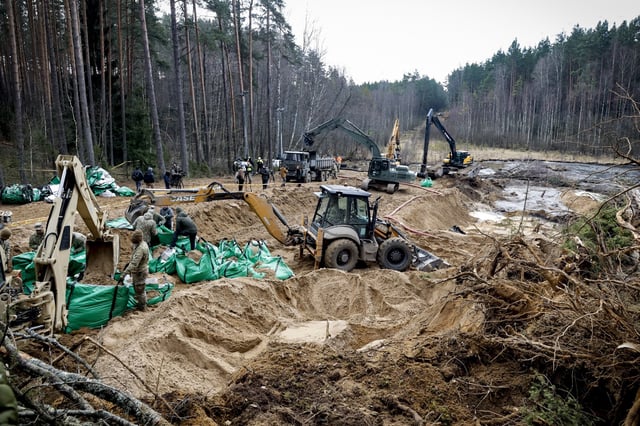 Military personnel work at the site of a rescue operation for missing U.S. soldiers at Pabrade training ground, in Lithuania, on March 28, 2025.