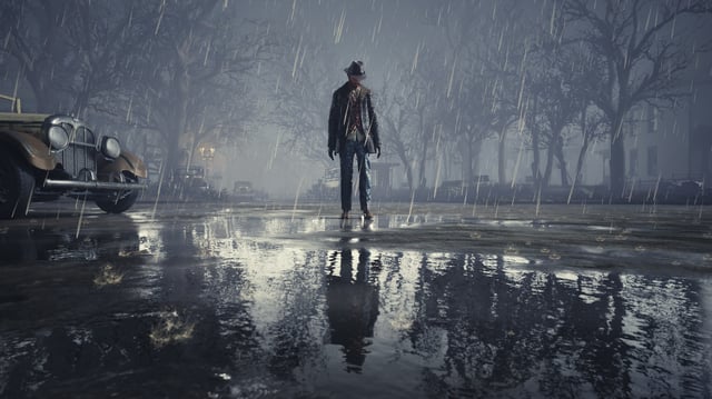 Charles W Reed standing in the rain in The Sinking City remaster. 