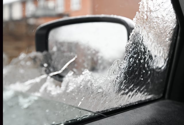 Ice is shown on the window of a car in Montreal, Sunday March 30, 2025, as several hours of freezing rain is forecasted for the area, possibly giving between 5 and 10 millimetres of ice accretion.