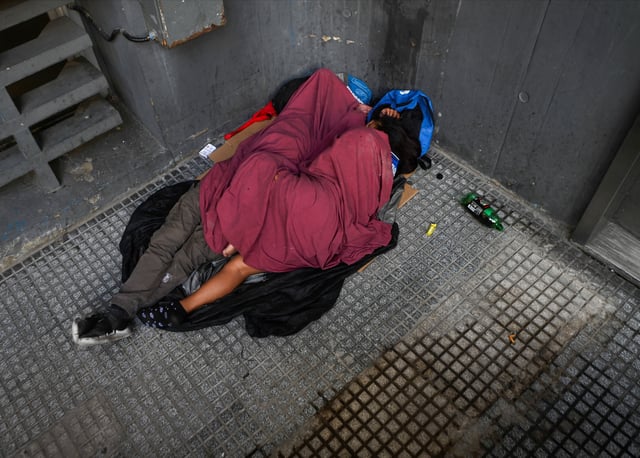 People sleep on the street, in Buenos Aires, Argentina March 29, 2025. REUTERS/Mariana Nedelcu