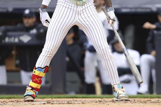 Jazz Chisholm Jr. holding his torpedo bat during the first inning on Sunday.