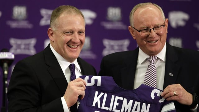 Chris Klieman, left, is introduced as the 35th Kansas State NCAA college football head coach by athletic director Gene Taylor, right, in Manhattan, Kan., Wednesday, Dec. 12, 2018. (AP Photo/Orlin Wagner)