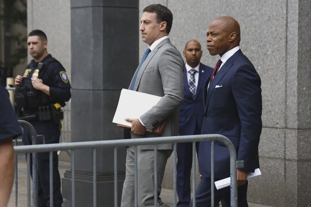 New York City Mayor Eric Adams and his lawyer Alex Spiro exit federal court after his arraignment on bribery and fraud charges on September 27, 2024 in New York City.