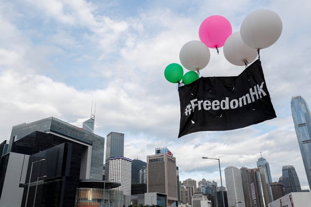 Balloons with protest slogans are seen outside the Legislative Council building during the anniversary of Hong Kong's handover to China in Hong Kong, China July 1, 2019. REUTERS/Tyrone Siu/File Photo