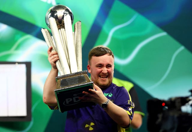 Darts - 2025 PDC World Darts Championship - Alexandra Palace, London, Britain - January 3, 2025 Luke Littler celebrates with the Sid Waddell trophy after winning the 2025 PDC World Darts Championship final against Michael van Gerwen Action Images via Reuters/Andrew Boyers/File Photo