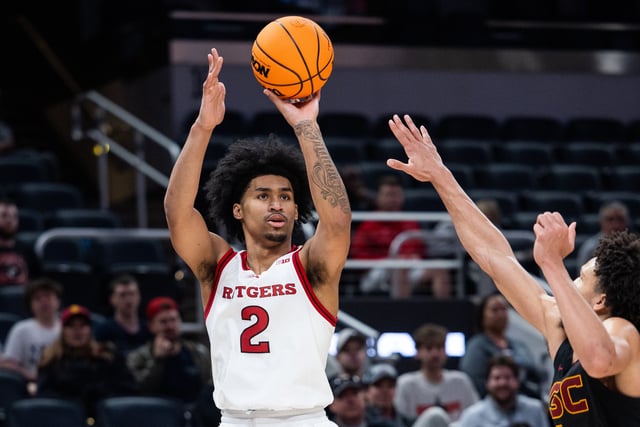 Mar 12, 2025; Indianapolis, IN, USA; Rutgers Scarlet Knights guard Dylan Harper (2) shoots the ball while USC Trojans guard Desmond Claude (1) defends in the second half at Gainbridge Fieldhouse. Mandatory Credit: Trevor Ruszkowski-Imagn Images/File Photo