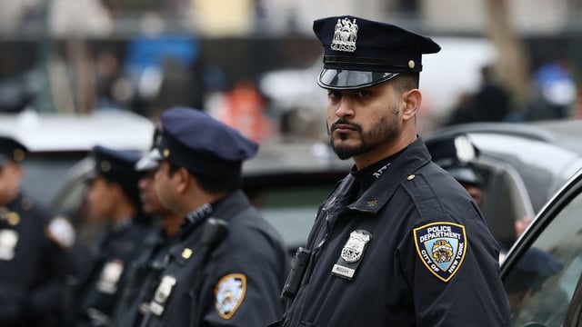 Two NYPD patrol officers were charged with forcibly touching a sex worker and stealing money from her purse