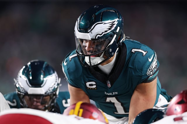 Quarterback Jalen Hurts sets up for the Eagles' signature "tush push" against the Washington Commanders during the second half of the NFC championship game in Philadelphia.