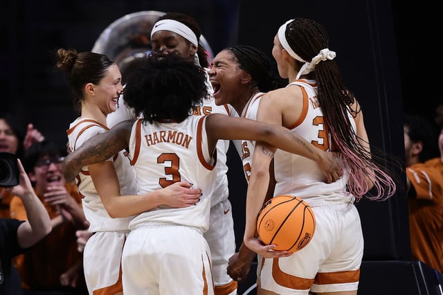 The Texas Longhorns celebrate during the second half against the TCU Horned Frogs in the Elite Eight round of the NCAA Women's Basketball Tournament at Legacy Arena at the BJCC on March 31, 2025 in Birmingham, Alabama.