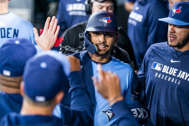 Toronto Blue Jays second baseman Andrés Giménez (0) celebrates a home run with his teammates during the second inning of MLB baseball action against the Washington Nationals, in Toronto, Monday, March 31, 2025. THE CANADIAN PRESS/Thomas Skrlj