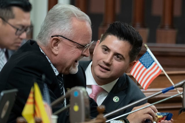 FILE - Republican Assembly members Tom Lackey, of Palmdale, left, and Bill Essayli, of Riverside, huddle at the Capitol in Sacramento, Calif., July 10, 2023. (AP Photo/Rich Pedroncelli, File)