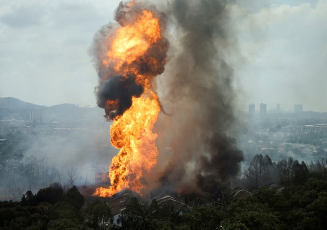 Flames and smoke rise froma a fire after a gas pipeline operated by Malaysia's state energy firm Petronas caught fire, in Puchong, Malaysia April 1, 2025. REUTERS/Stringer