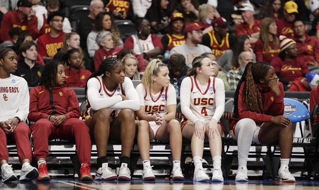 Players on the USC bench watch during the final moments of their 78-64 loss to UConn in an NCAA Tournament regional final on Monday night in Spokane, Wash. (AP Photo/Young Kwak)