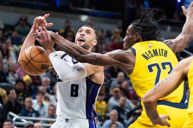 Mar 31, 2025; Indianapolis, Indiana, USA; Sacramento Kings guard Zach Lavine (8) shoots the ball while Indiana Pacers forward Aaron Nesmith (23) defends in the second half at Gainbridge Fieldhouse. Mandatory Credit: Trevor Ruszkowski-Imagn Images