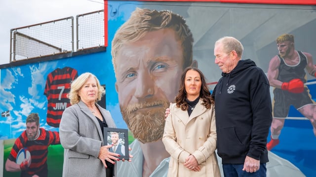 Trish and Neil Henderson with their son’s fiancée, Jacqui, outside the Henderson Academy boxing club, renamed in memory of Jim, who was also a keen rugby player