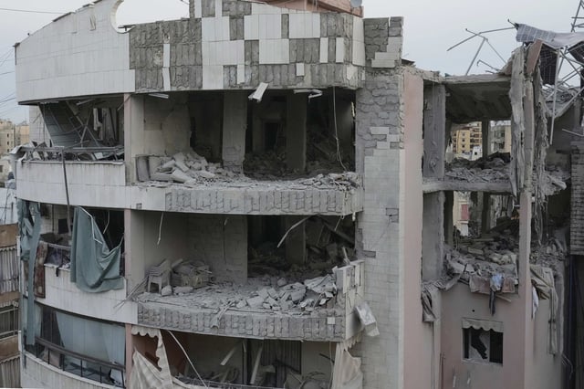 Damaged apartment buildings are seen after being struck earlier by an Israeli attack in Dahiyeh, a southern suburb of Beirut, Lebanon, early Tuesday, April 1, 2025. (AP Photo/Hussein Malla)