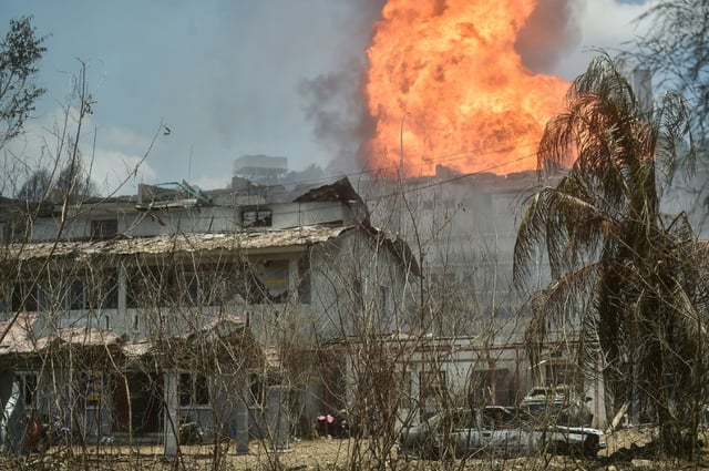 While the early morning blaze was coming under control in the afternoon, more than 100 people were injured