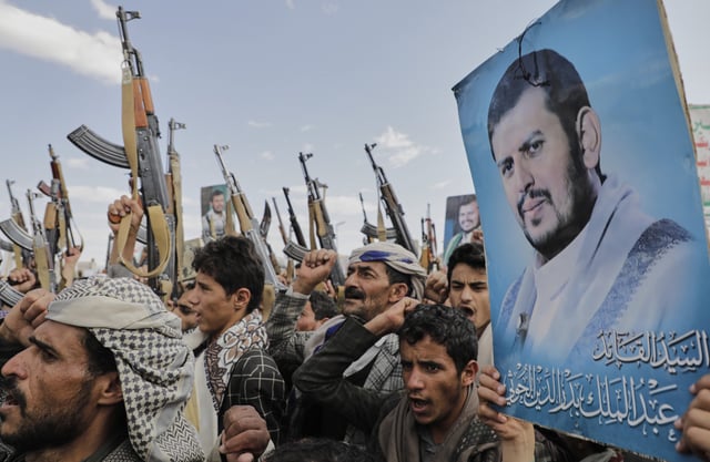 Houthi supporters chant slogans and hold pictures of Abdul Malik al-Houthi, the leader of the Houthi movement, during an anti-U.S. and anti-Israel rally in Sanaa, Yemen, Monday, March 17, 2025.
