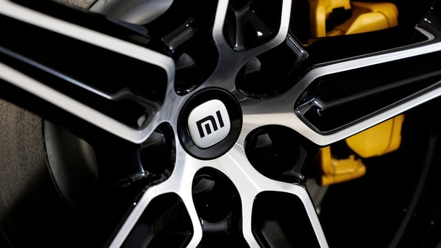 The logo of Xiaomi is seen on a tyre wheel of Xiaomi's first electric vehicle SU7, which is displayed at a showroom of a newly opened Xiaomi store in Beijing, China March 25, 2024.