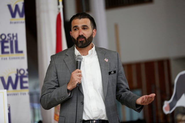 Josh Weil, a schoolteacher and Democratic candidate for Florida's 6th Congressional District seat in the U.S. House of Representatives, speaks at a town hall event in Ocala, Florida, U.S. March 26, 2025.