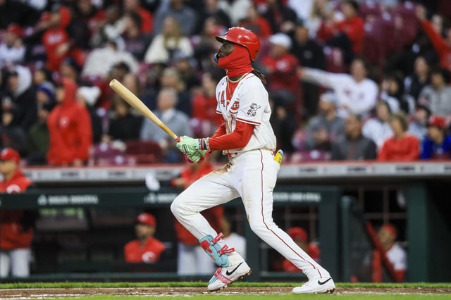 Mar 31, 2025; Cincinnati, Ohio, USA; Cincinnati Reds shortstop Elly De La Cruz (44) hits a three-run home run in the second inning against the Texas Rangers at Great American Ball Park. Mandatory Credit: Katie Stratman-Imagn Images
