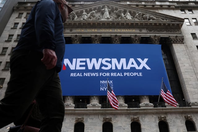 A banner for Newsmax Inc. is displayed during the company’s IPO at the New York Stock Exchange (NYSE) in New York City, U.S., March 31, 2025.  REUTERS/Brendan McDermid/File Photo