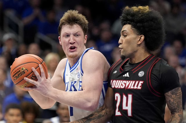 Duke guard Kon Knueppel drives to the basket past Louisville guard Chucky Hepburn during the second half of an NCAA college basketball game in the championship of the Atlantic Coast Conference tournament, Saturday, March 15, 2025, in Charlotte, N.C.