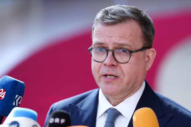Finland's Prime Minister Petteri Orpo speaks to the media as he attends a European Union summit in Brussels, Belgium March 20, 2025. REUTERS/Yves Herman/File Photo