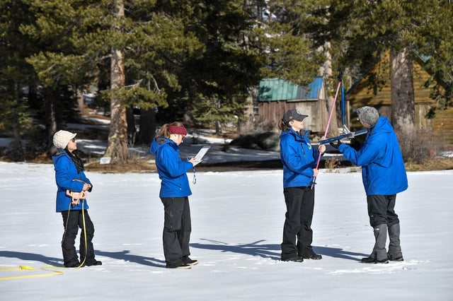 California Department of Water Resources staff (from left) Angelique Fabbiani-Leon, State Hydrometeorologist, Manon von Kaenel, Water Resources Engineer, Jordan Thoennes, Water Resources Engineer, and Andy Reising, Snow Surveys and Water Supply Forecasting Unit Manager, conduct the first media snow survey of the 2025 season at Phillips Station in the Sierra Nevada. The survey is held approximately 90 miles east of Sacramento off Highway 50 in El Dorado County. Photo taken January 2, 2025. 