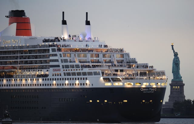 File photo of the Queen Mary 2 sailing near the Statue of Liberty in New York Harbor to meet the QE2 October 16, 2008 in New York.
