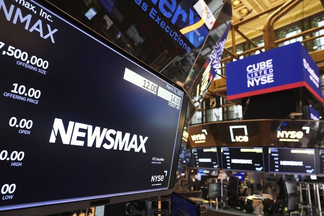 A display shows a Newsmax logo on the day of their IPO on the floor at the New York Stock Exchange.