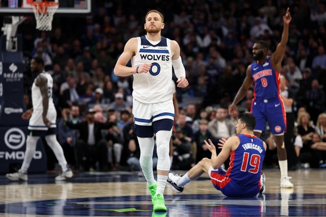 Mar 30, 2025; Minneapolis, Minnesota, USA; Minnesota Timberwolves guard Donte DiVincenzo (0) looks on during the first quarter against the Detroit Pistons at Target Center. Mandatory Credit: Matt Krohn-Imagn Images