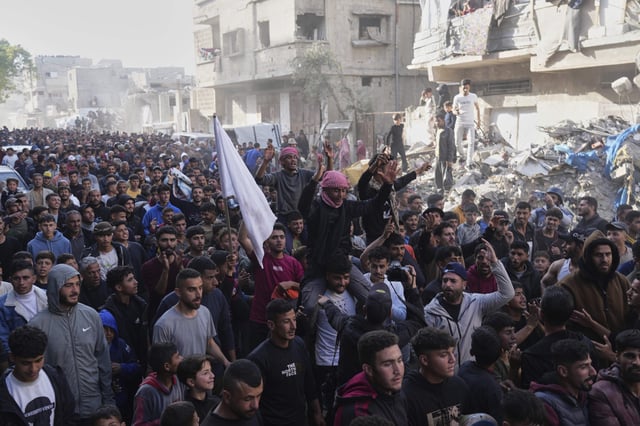 Palestinians chant slogans during an anti-war protest and against Hamas in a rare show of public anger against the militant group that rules the territory, in Beit Lahiya, northern Gaza Strip, on March 26, 2025.