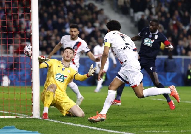 Soccer Football - Coupe de France - Semi Final - USL Dunkerque v Paris St Germain - Decathlon Arena Stade Pierre-Mauroy, Villeneuve-d'Ascq, France - April 1, 2025  Paris St Germain's Marquinhos scores their second goal REUTERS/Stephanie Lecocq