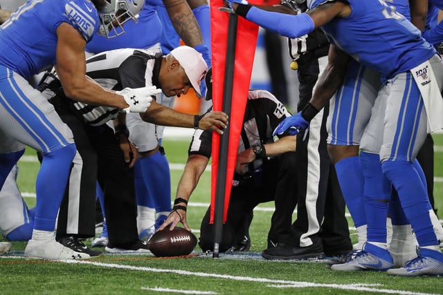 Referees measure for the first down during a game between the Detroit Lions and the Tampa Bay Buccaneers in 2019.