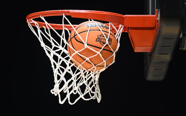 Mar 27, 2025; Indianapolis, IN, USA; The March Madness logo is seen on a basketball during the NCAA tournament midwest regional practice day at Lucas Oil Stadium. Mandatory Credit: Robert Goddin-Imagn Images/File Photo