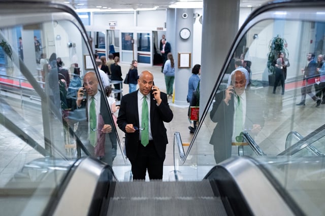 A man listed as a special assistant to Sen. Cory Booker was arrested Monday night with a weapon. Above, Booker is pictured arriving for a vote in the Capitol in February 2024.