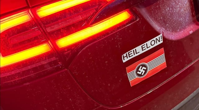 Chicago resident Peter Katz found stickers with Nazi symbolism on his Tesla last month. (Facebook)